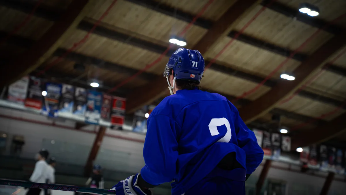 Ice hockey player in blue jersey number 71