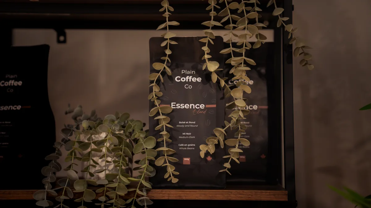 Plain Coffee Co Essence Blend on shelf with greenery